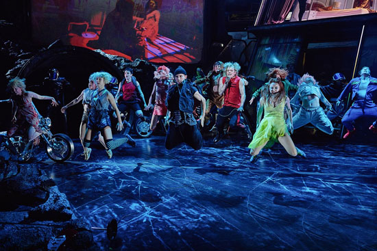 Scene from Bat Out Of Hell The Musical : Strat and The Lost are jumping in unison, as if levitating