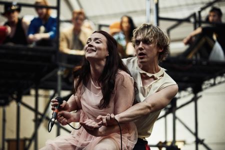 the cast of Bat Out Of Hell the Musical in rehearsal; Strat (Andrew Polec) and Raven (Christina Bennington) in foreground