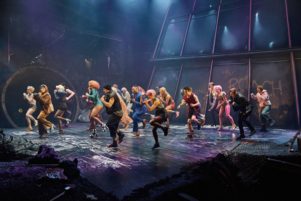 Scene from Bat Out Of Hell The Musical. The ensemble cast - members of The Lost are dancing, facing to the left
