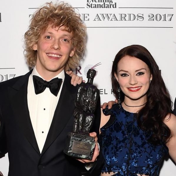 Andrew Polec and Christina Bennington posing with the award for Best Musical