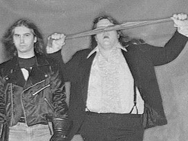 Jim Steinman (left) and Meat Loaf (right, holding cloth in front of his eyes)