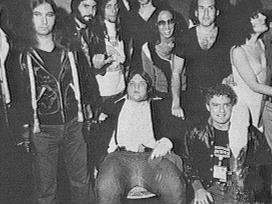 group archive photo of Jim Steinman (left), Meat Loaf (centre, seated), Karla DeVito (right), and many others